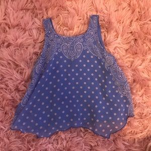 Polka dot patterned blouse.